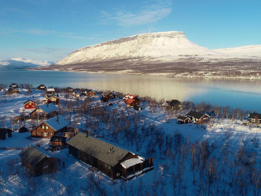 an aerial view of a village in the snow with a mountain at Holiday Home Haltinmalla by Interhome in Kilpisjärvi