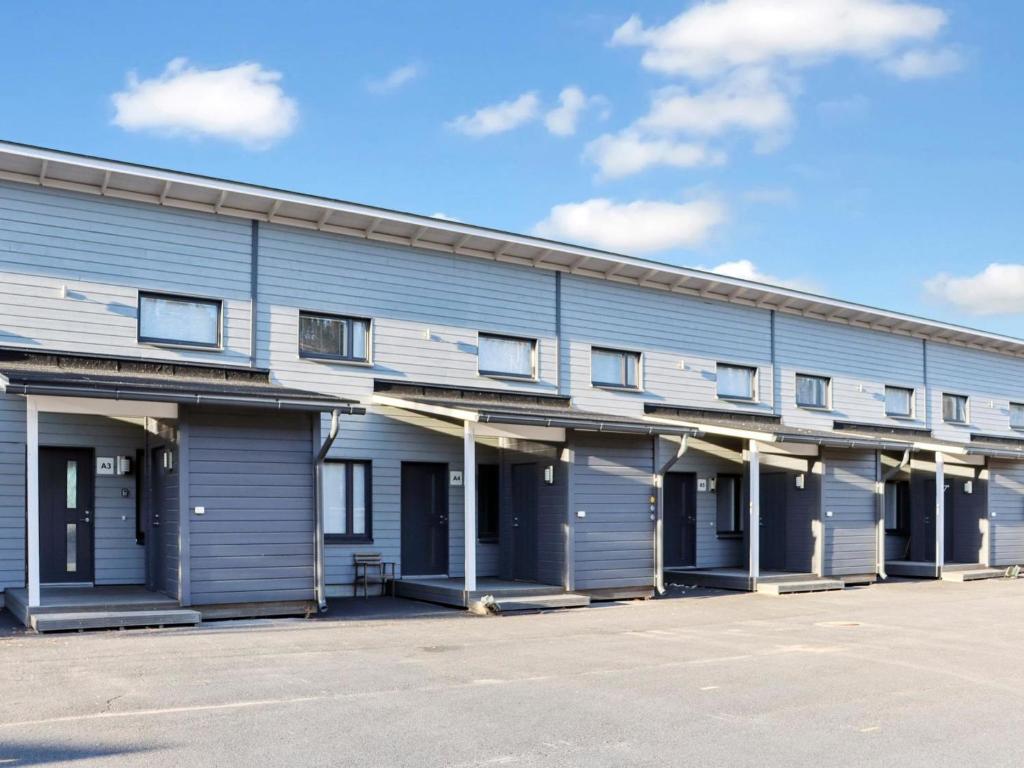 an empty parking lot in front of a building at Holiday Home Skivillas 78 - 4 by Interhome in Hyrynsalmi