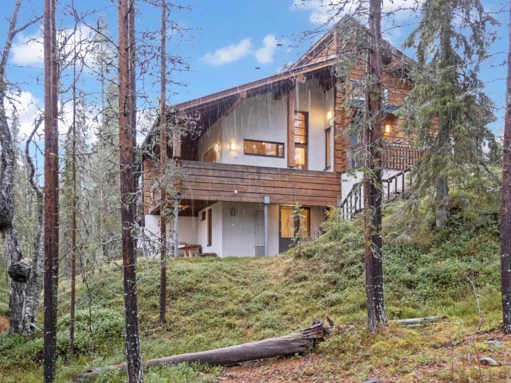a house on a hill in the woods at Holiday Home Sallan lumous b by Interhome in Salla