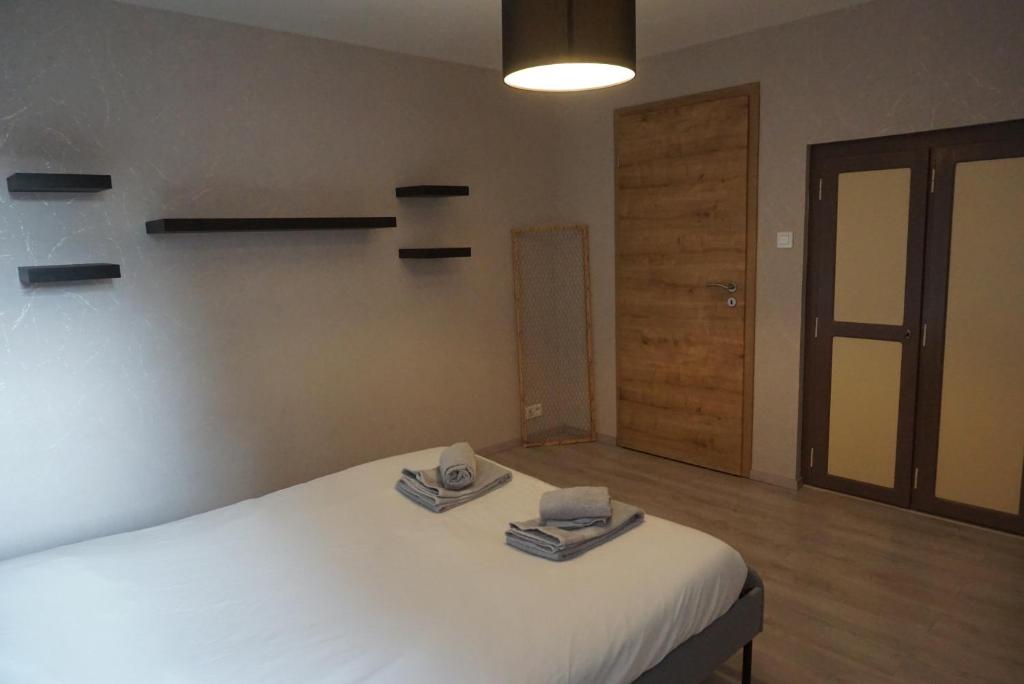 Postel nebo postele na pokoji v ubytování L'Aubach - appartement spacieux - au pied du vignoble - parking gratuit