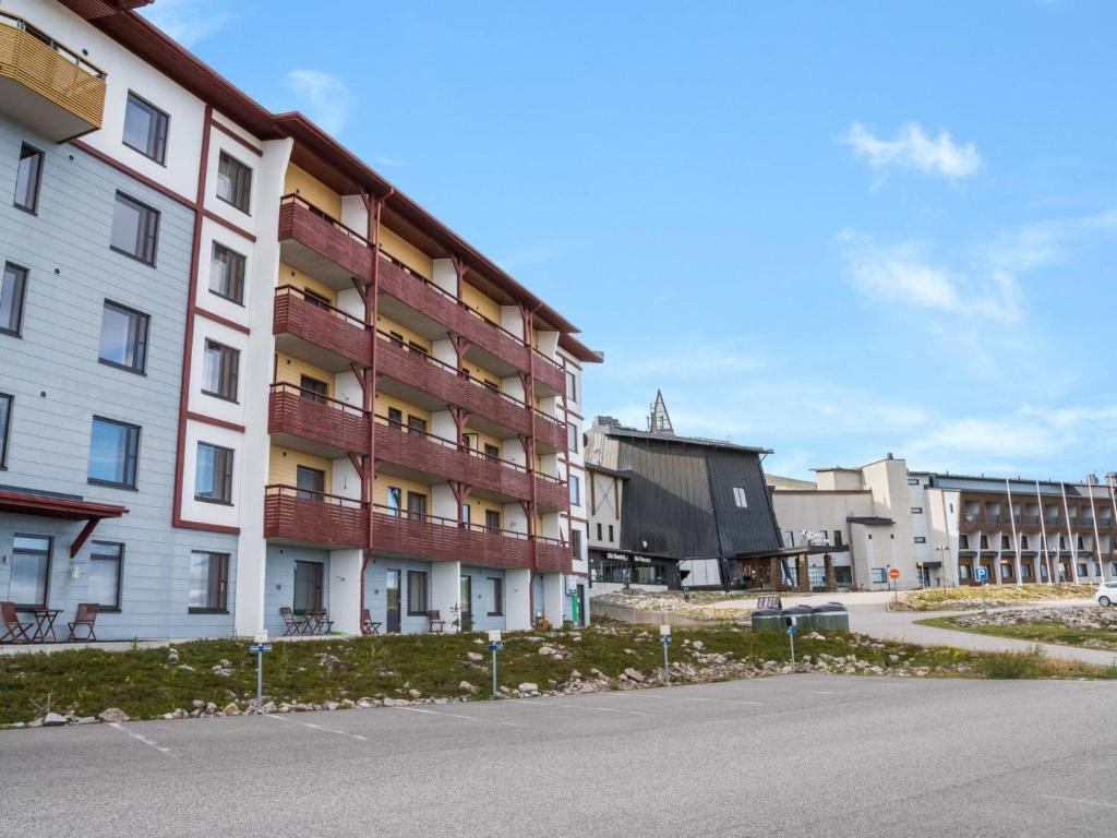an empty street in front of an apartment building at Holiday Home Ylläs chalets a307 by Interhome in Ylläs