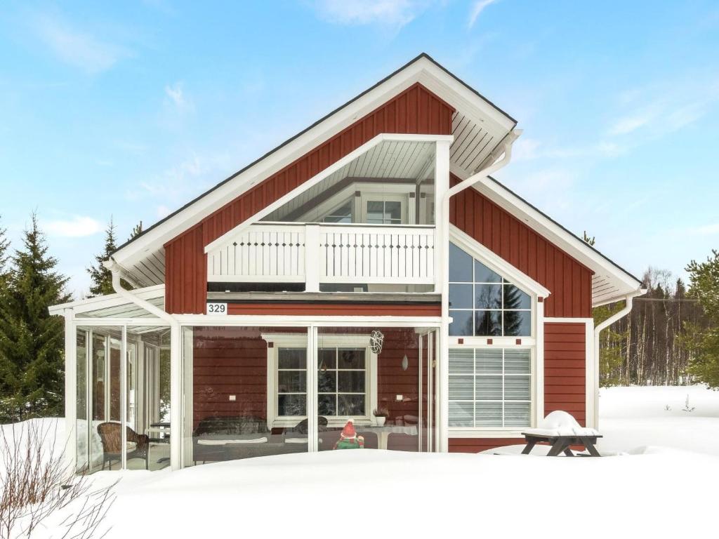 a house with a large window on the front of it at Holiday Home Pyrykieppi by Interhome in Sonka