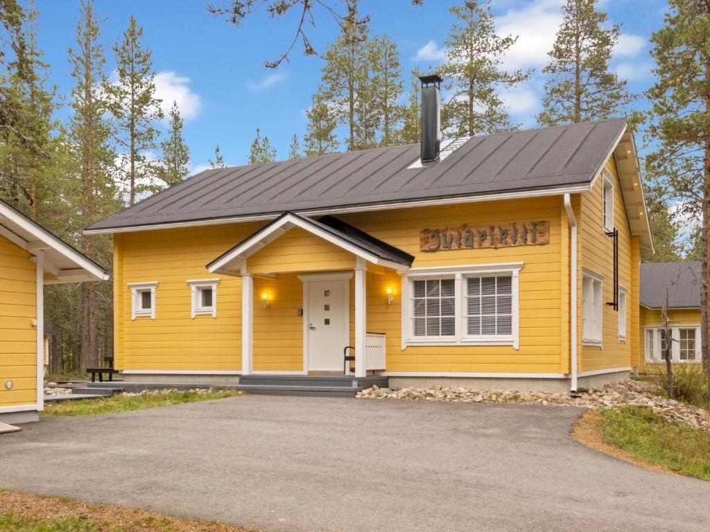 a yellow building with a sign that reads durango at Holiday Home Jutapirtti by Interhome in Levi