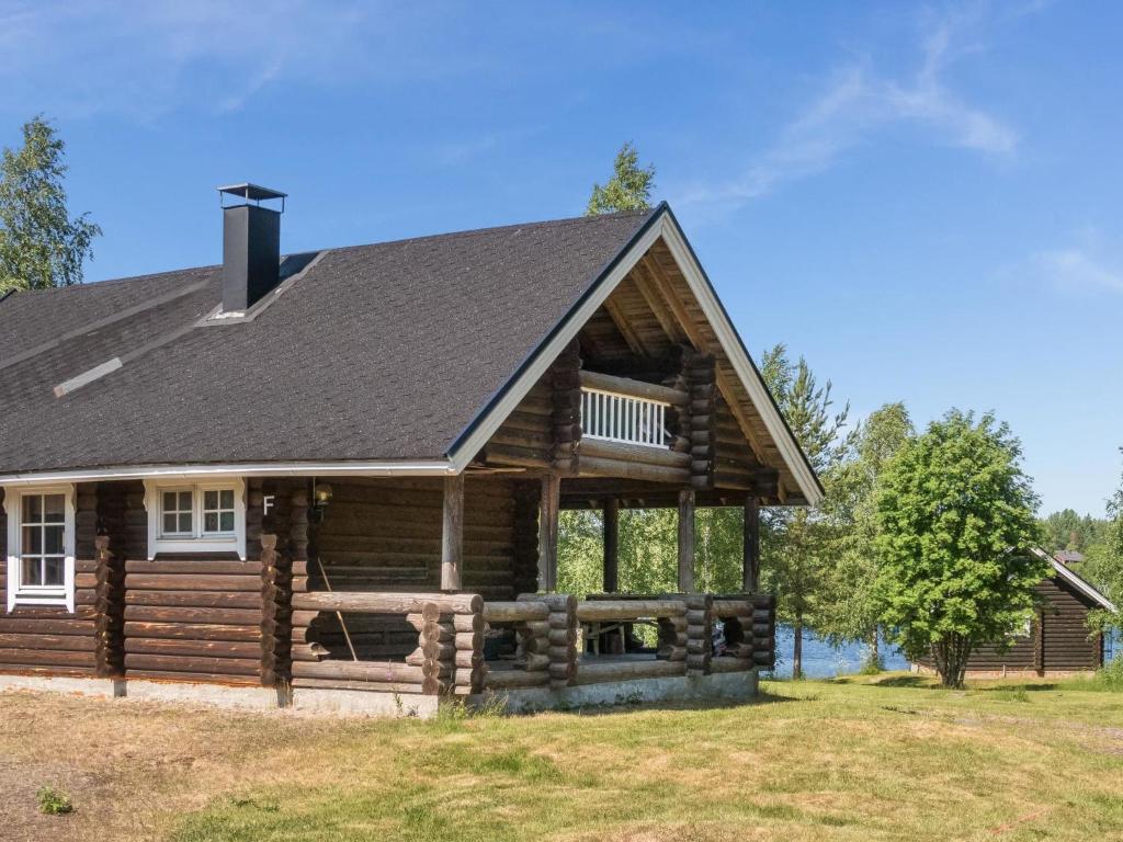 a log cabin with a gambrel roof at Holiday Home Vuokatticottage f by Interhome in Vuokatti