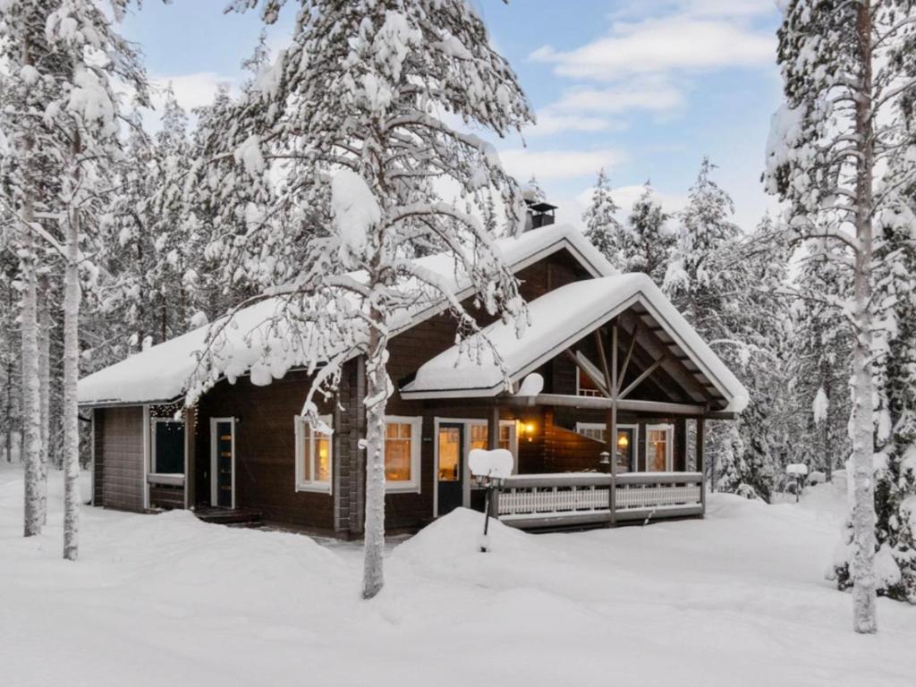 a cabin in the woods in the snow at Holiday Home Ansa by Interhome in Sirkka