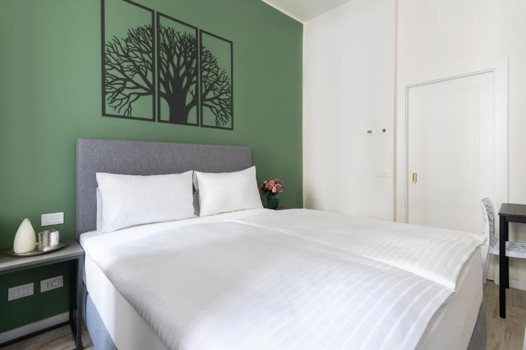 Postel nebo postele na pokoji v ubytování Kinsky Garden Apartments and Suites by Dwellfort