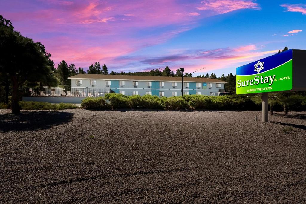 a building with a sign in front of it at SureStay Hotel by Best Western Williams - Grand Canyon in Williams