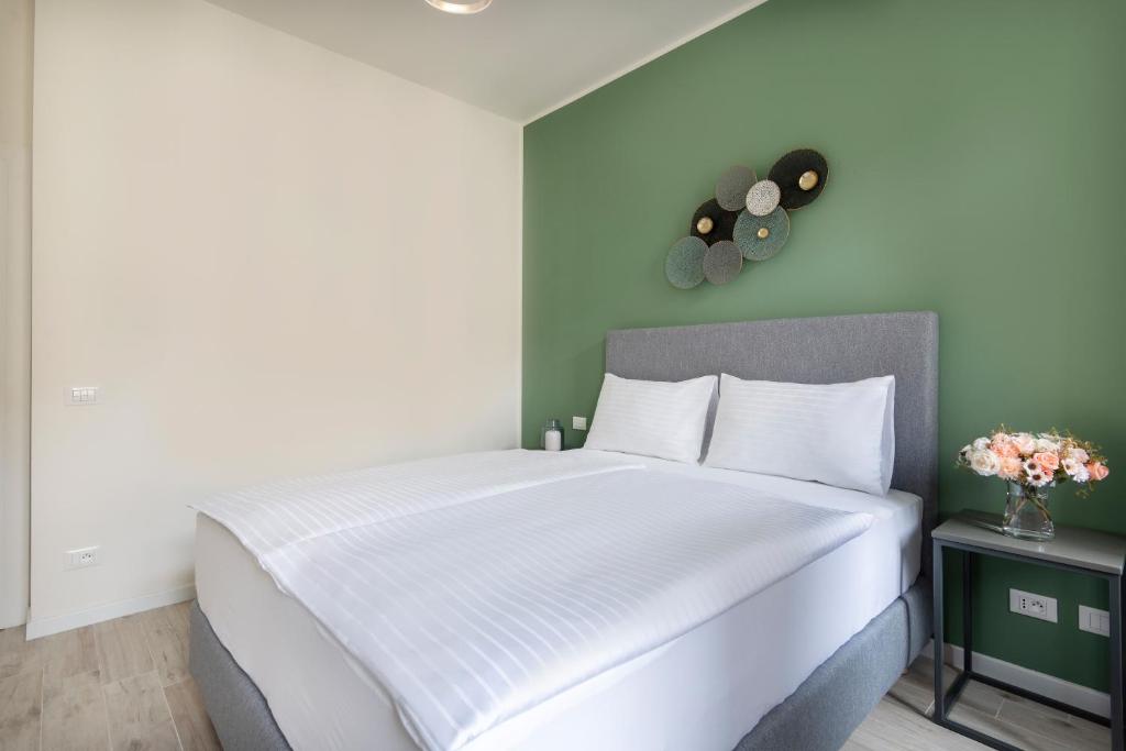 Postel nebo postele na pokoji v ubytování Kinsky Garden Apartments and Suites by Dwellfort