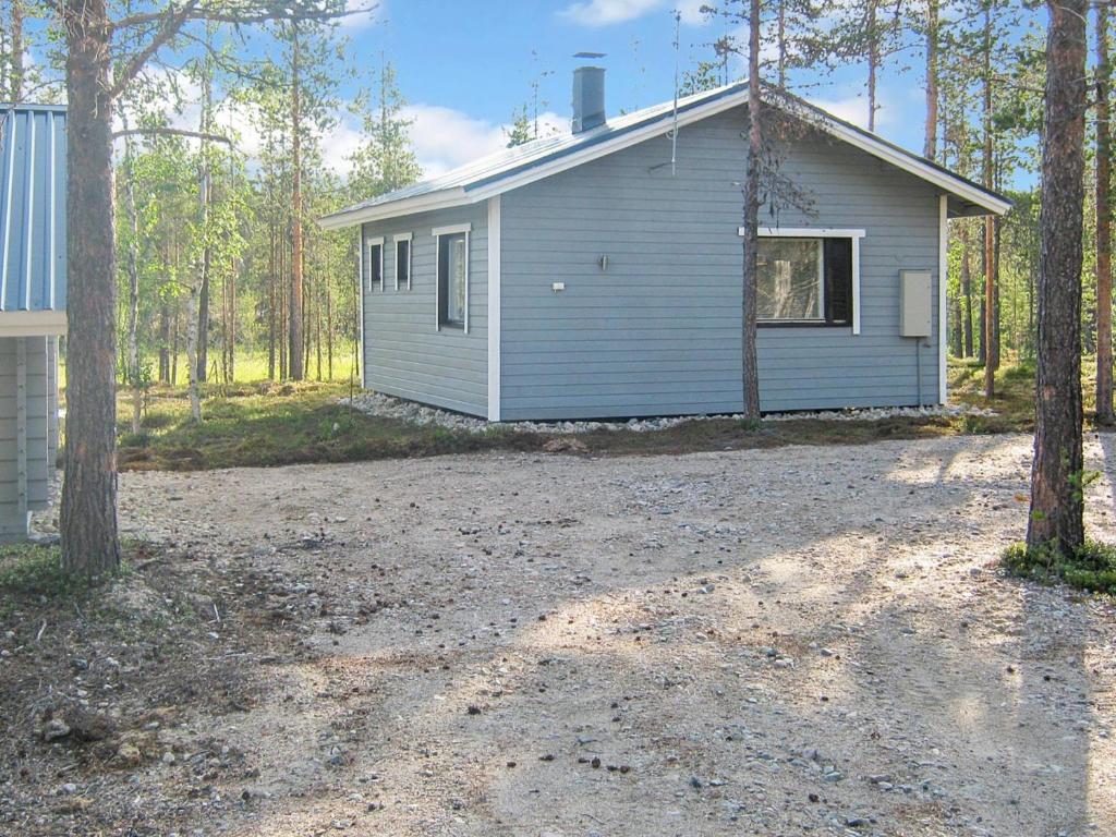 a house with a gravel driveway in front of it at Holiday Home Riekko by Interhome in Enontekiö