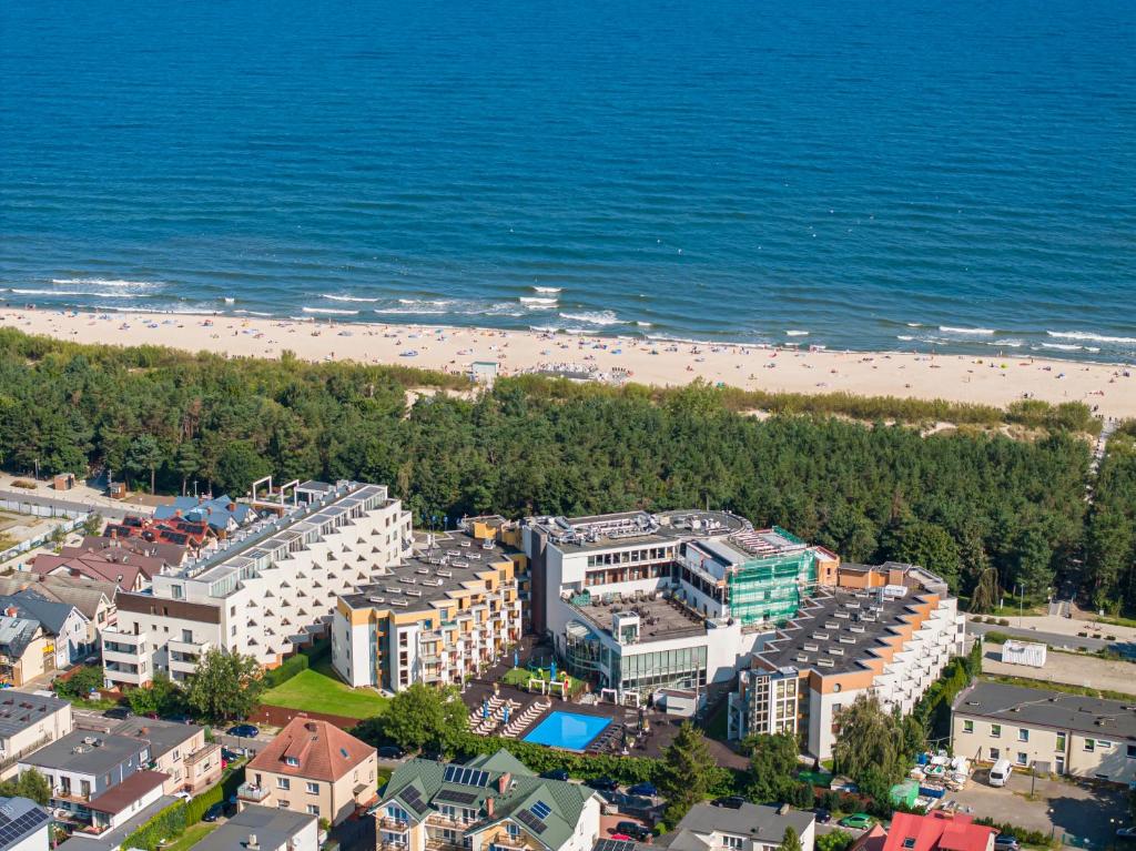 an aerial view of a beach with hotels and condos at Maloves Resort & Spa in Władysławowo