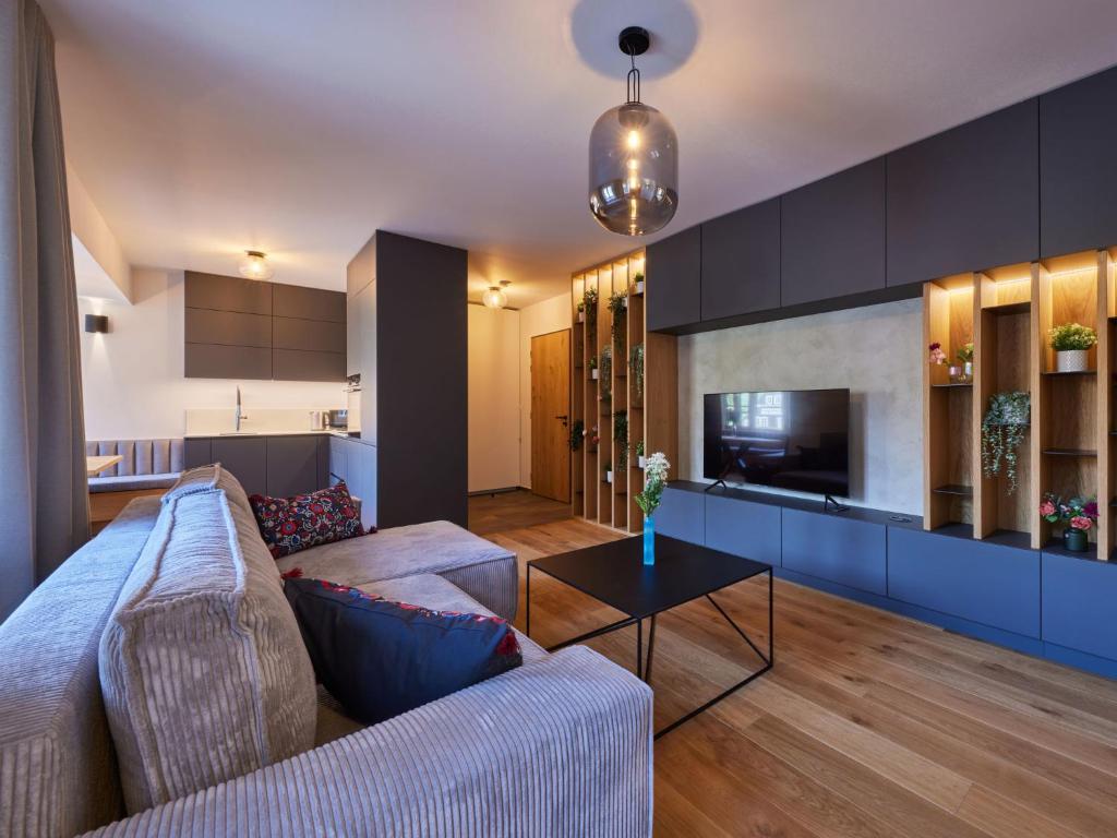 TV a/nebo společenská místnost v ubytování Apartment Máj-3 by Interhome