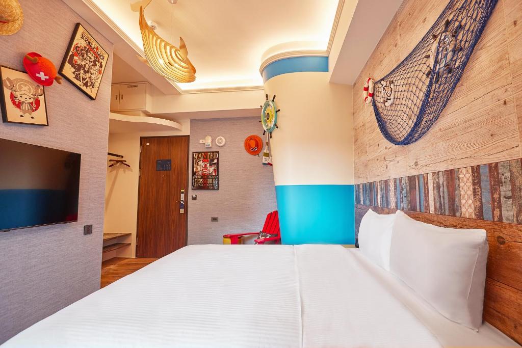 Postel nebo postele na pokoji v ubytování 星澄風旅 Zela Design Hotel