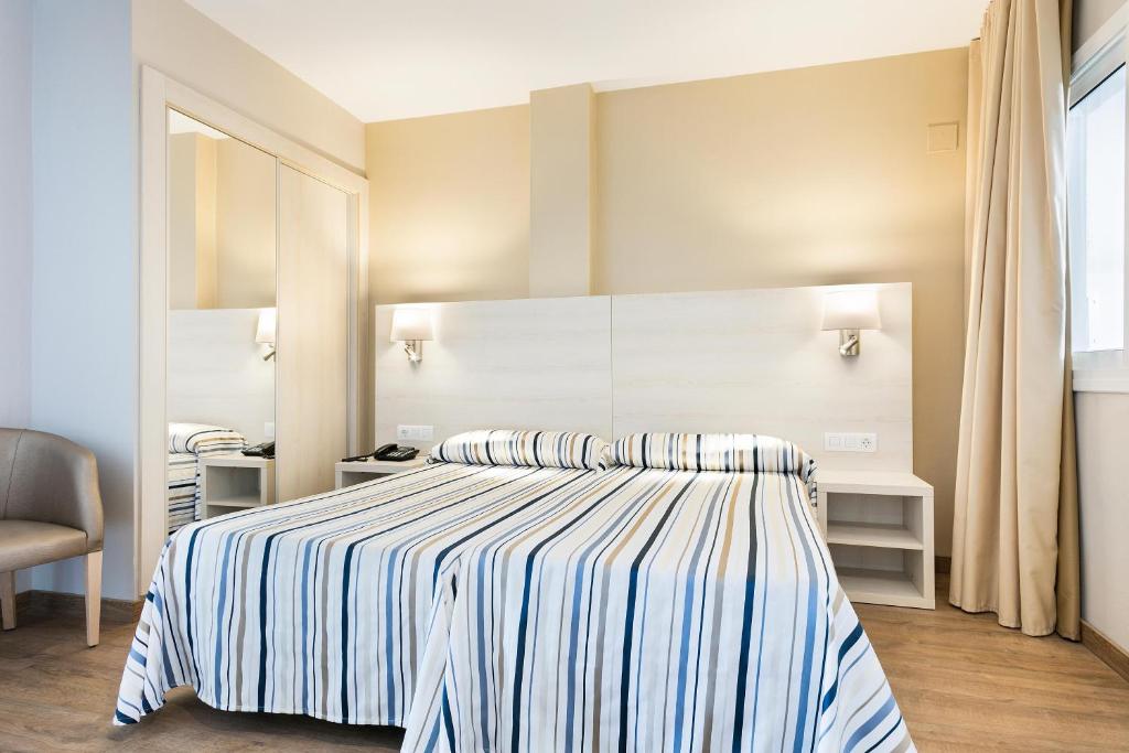 Postel nebo postele na pokoji v ubytování Hotel Best Da Vinci