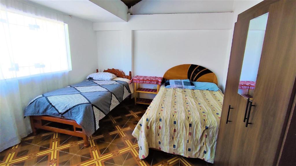 Postel nebo postele na pokoji v ubytování APARTAMENTO VISTA IMPERIAL II Mirador Panoramico