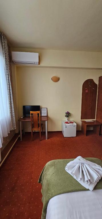 Postel nebo postele na pokoji v ubytování Hotel Olimp