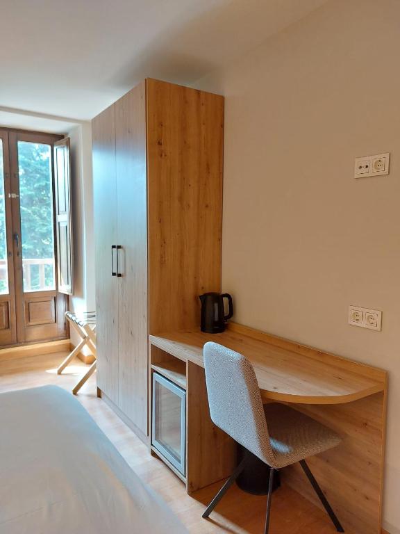Posteľ alebo postele v izbe v ubytovaní Hotel Saurat