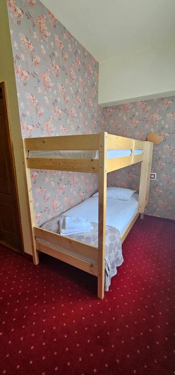 Postel nebo postele na pokoji v ubytování Hotel Olimp