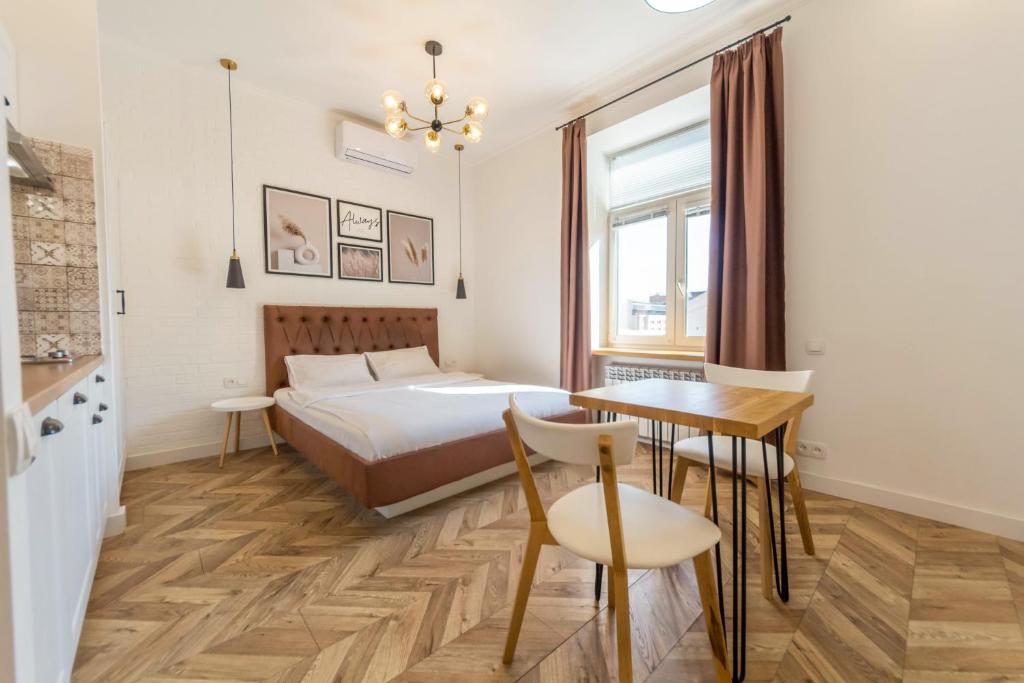 Postel nebo postele na pokoji v ubytování Idea Design Apart-Hotel Chykalenka