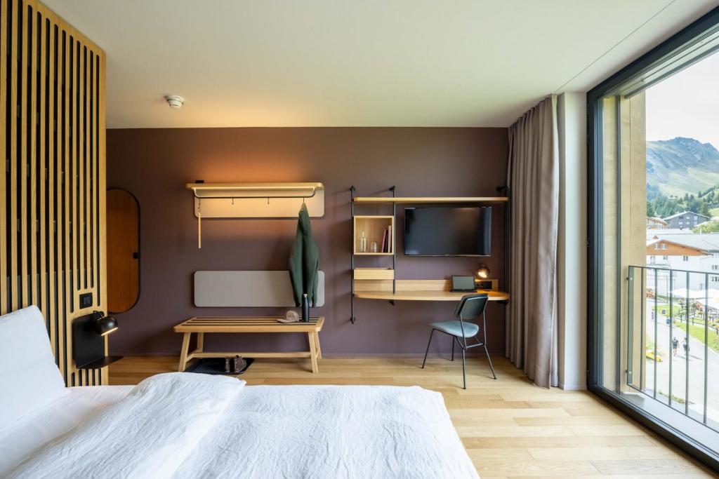 Letto o letti in una camera di Stoos Lodge