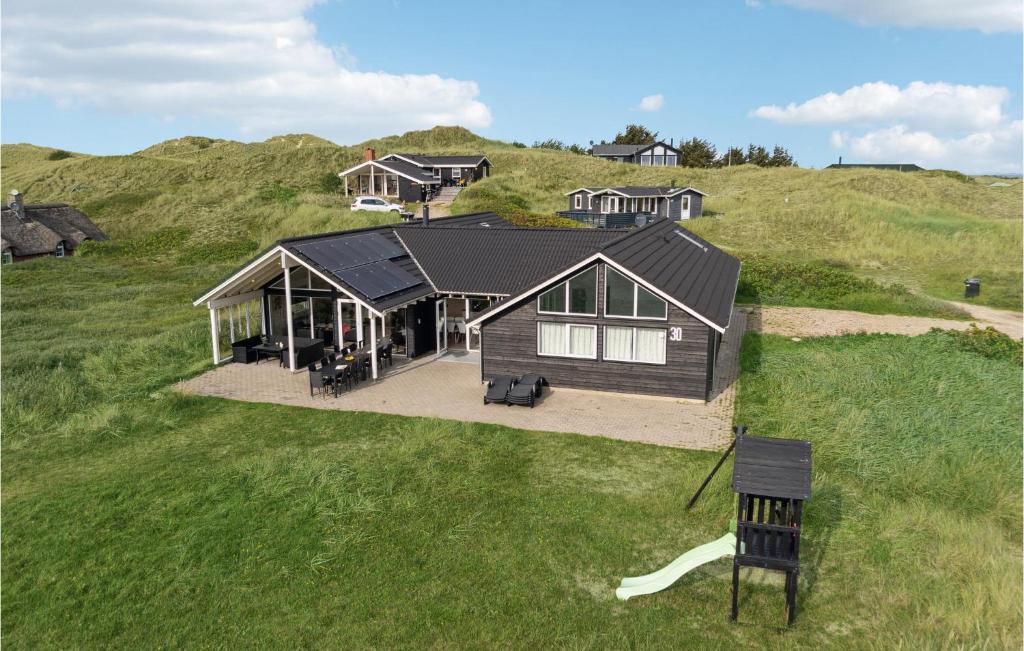 an overhead view of a house on a hill at Amazing Home In Hvide Sande With House A Panoramic View in Havrvig
