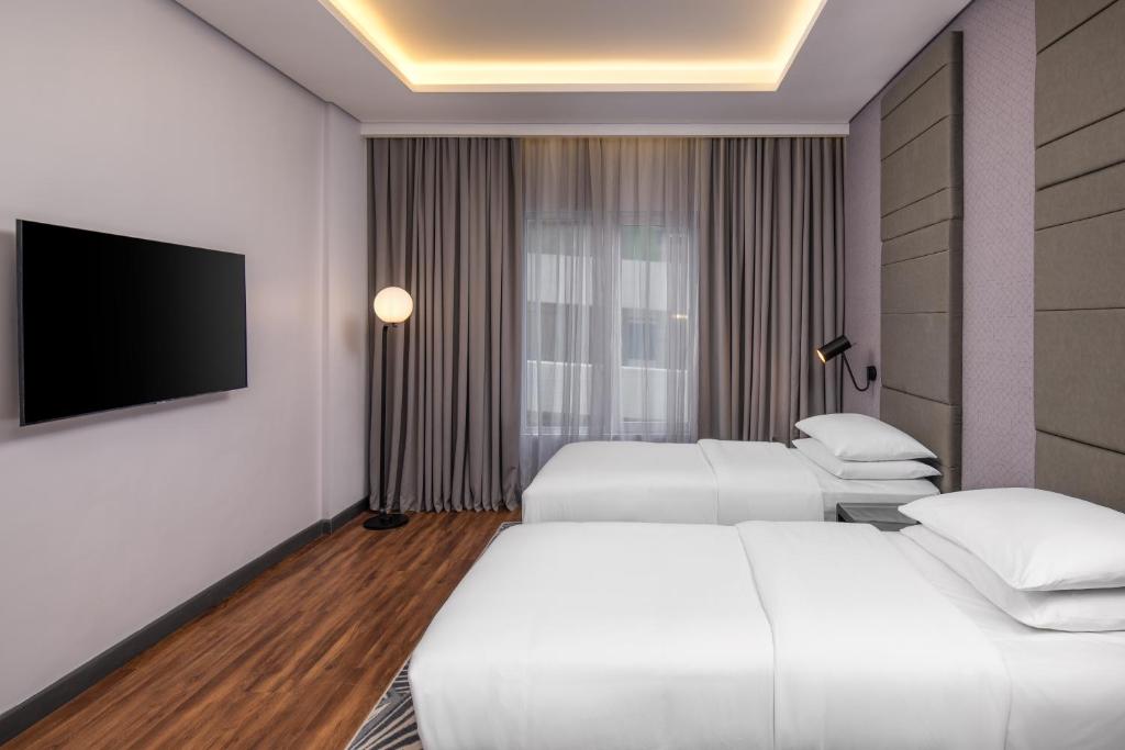 Postel nebo postele na pokoji v ubytování Four Points by Sheraton Lagos