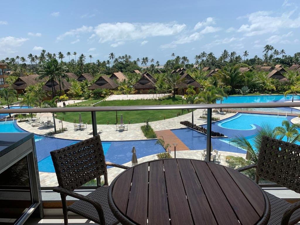 a view of the pool from the balcony of a resort at FLAT ECO RESORT PRAIA DOS CARNEIROS in Tamandaré