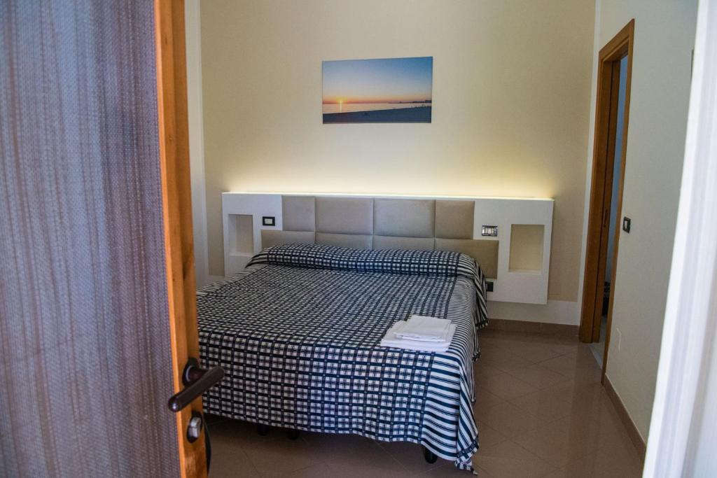 Postel nebo postele na pokoji v ubytování Hotel Parco Carabella