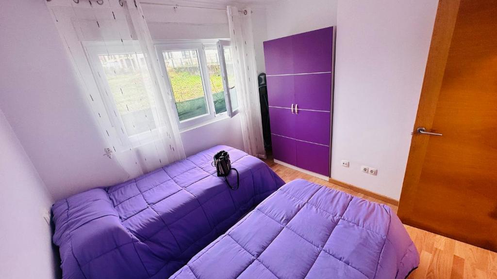Postel nebo postele na pokoji v ubytování Junto Camino De Santiago,1ª línea de playa