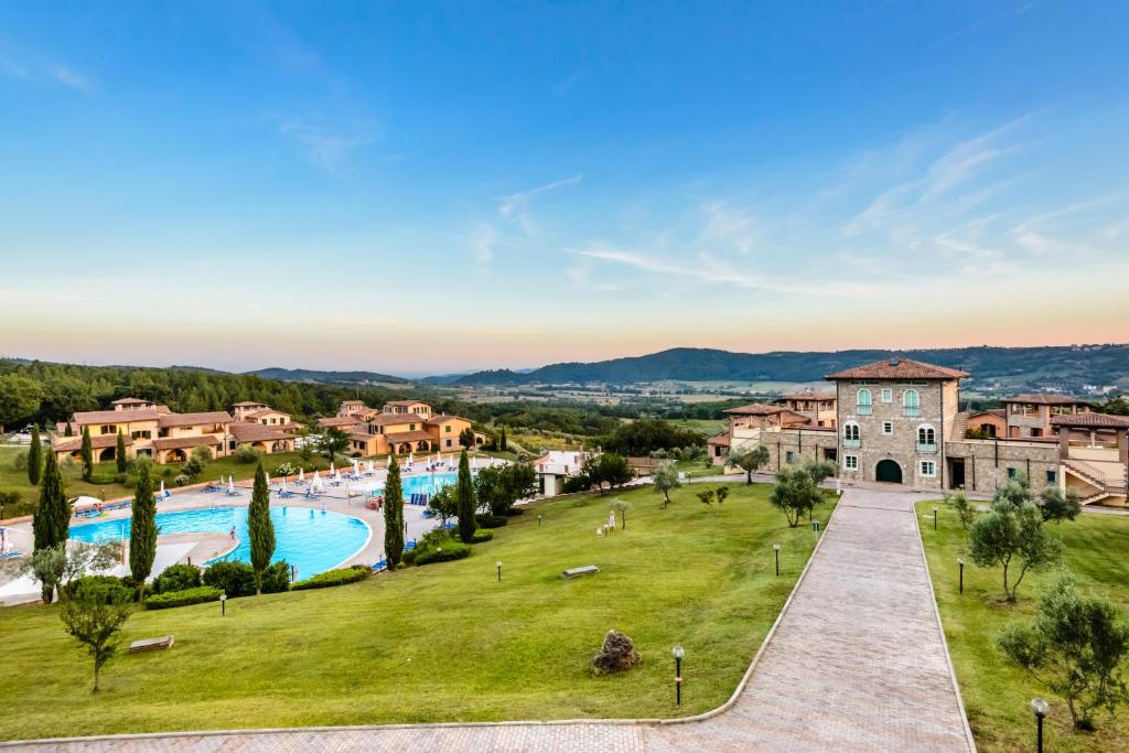an aerial view of a resort with a swimming pool at Pian Dei Mucini Resort in Massa Marittima