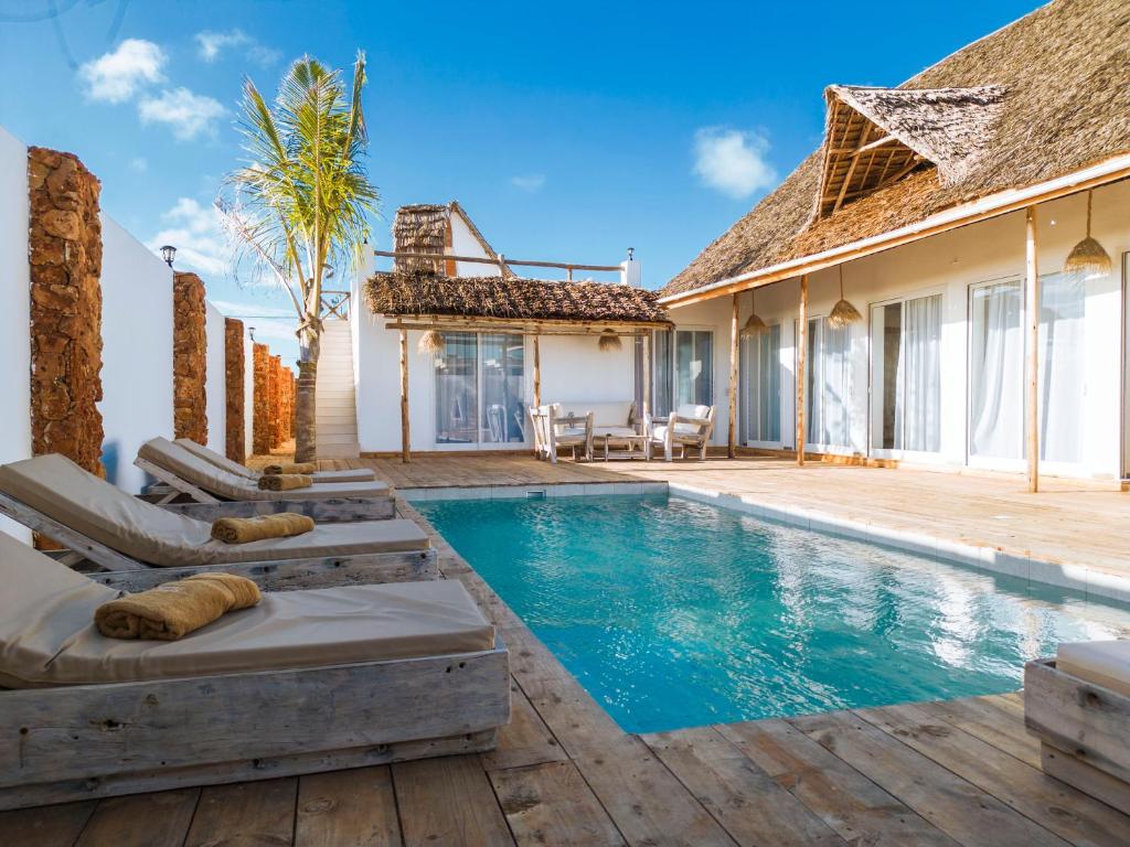 an image of a villa with a swimming pool at Limiria Villa Zanzibar in Nungwi