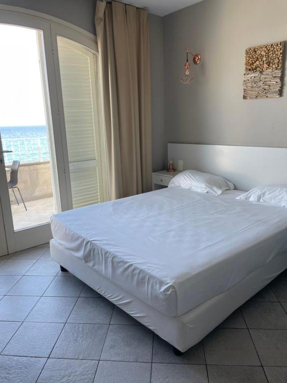 Postel nebo postele na pokoji v ubytování Torremare
