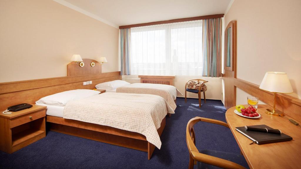 Postel nebo postele na pokoji v ubytování Hotel Cernigov