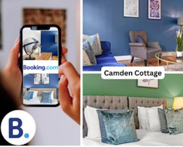 een persoon die een foto neemt van een slaapkamer met een telefoon bij Camden Cottage, 2 Bedroom house in Camden Town in Londen