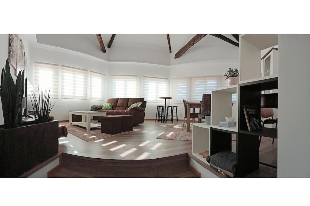 a living room with a couch and a table at Mirador Porta da Vila, Noia in Noya