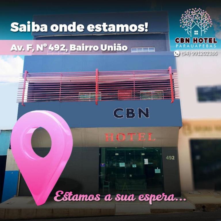 un cartel rosa está frente a un hotel en CBN HOTEL, en Parauapebas