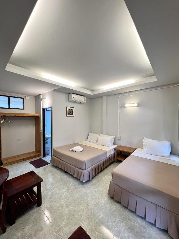 Ein Bett oder Betten in einem Zimmer der Unterkunft Pen's Bungalow Koh Phangan