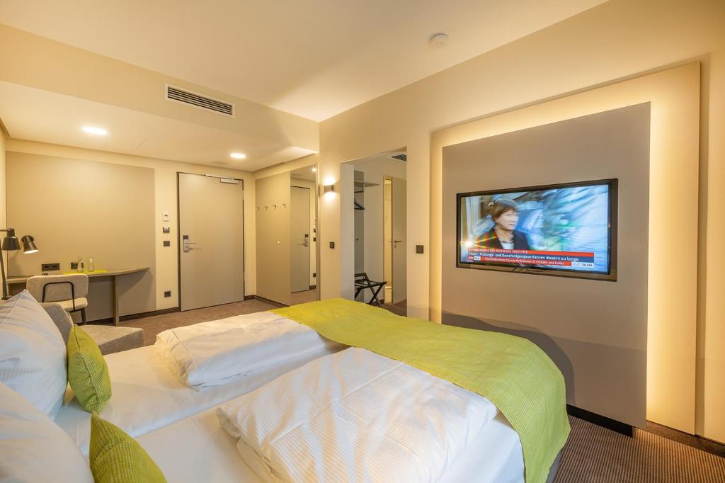 TV a/nebo společenská místnost v ubytování th Hotel Leipzig Messe