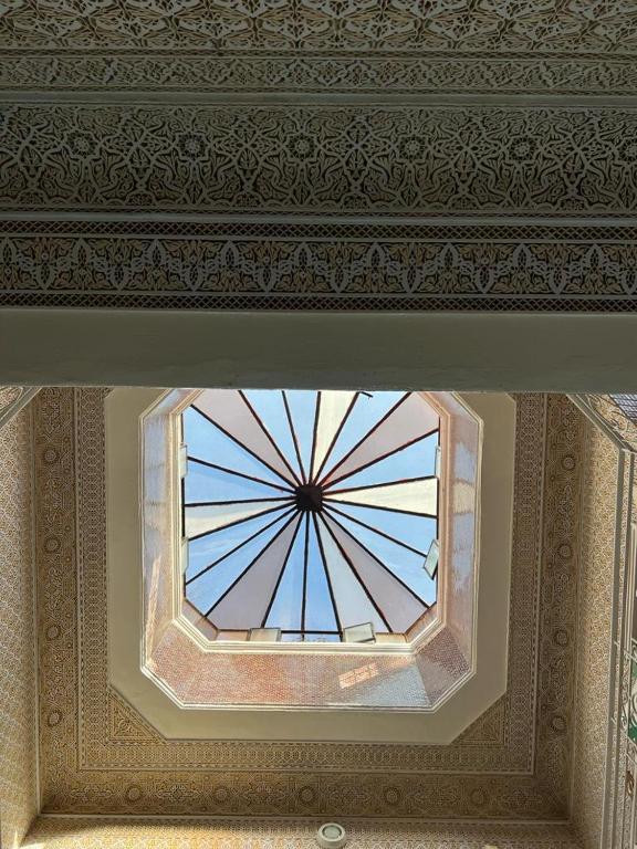 a ceiling with a window in a room at Riad Del Rey in Rabat