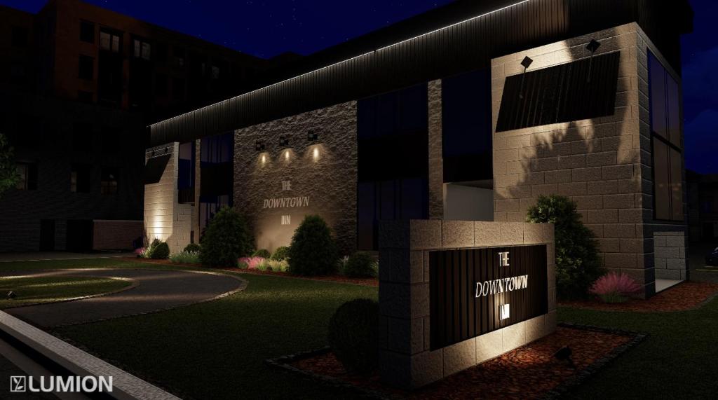 a rendering of the front of a building at night at Downtown Inn in Rochester