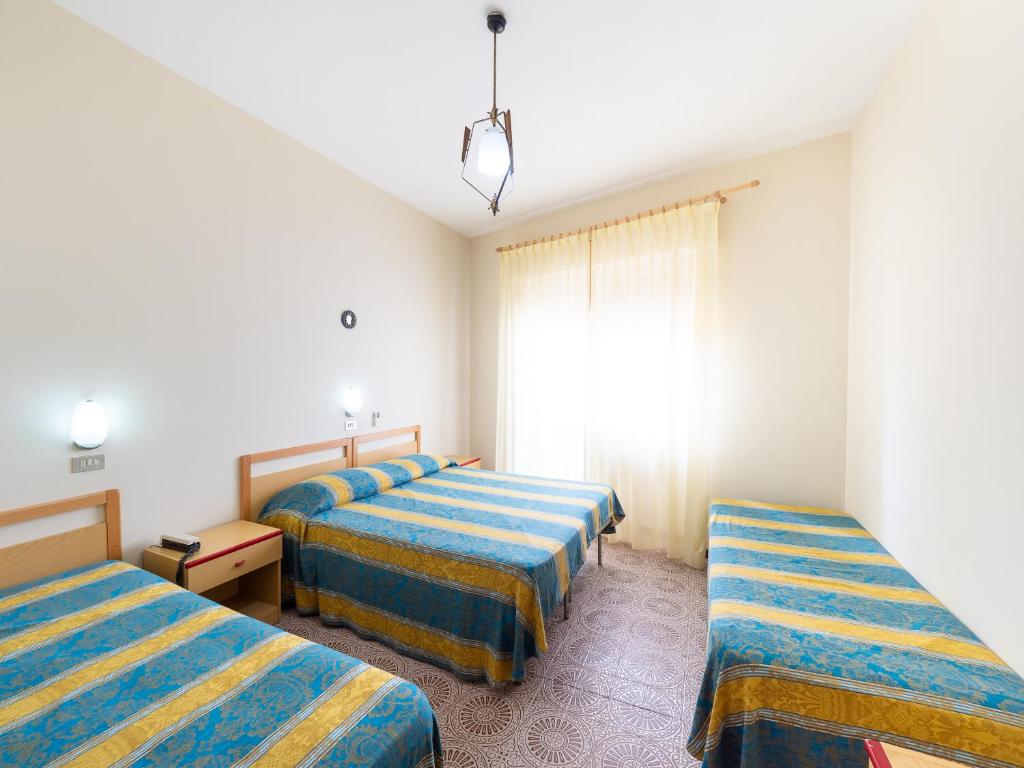 Postel nebo postele na pokoji v ubytování Hotel Blurelda