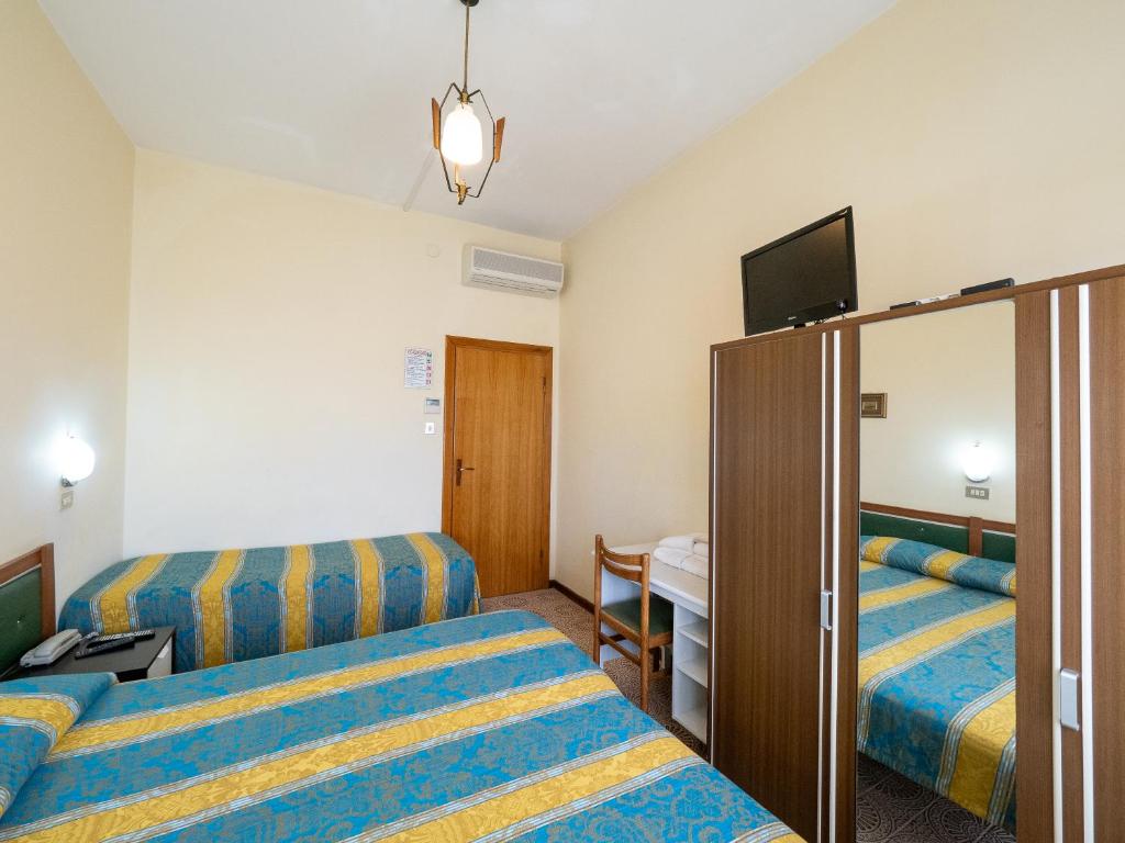 Postel nebo postele na pokoji v ubytování Hotel Blurelda