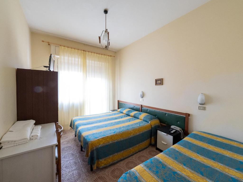 Postel nebo postele na pokoji v ubytování Hotel Blurelda