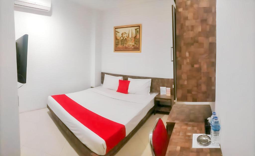 Postel nebo postele na pokoji v ubytování Hotel Domino