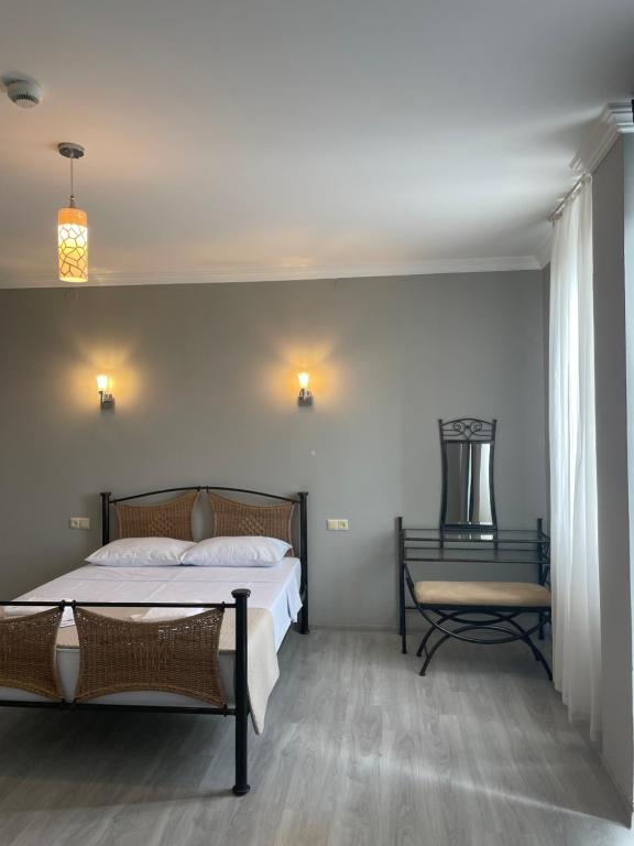 Postel nebo postele na pokoji v ubytování Argo Hotel