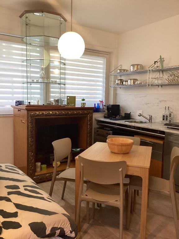 a kitchen with a table and a dining room at Il mare a due passi in Civitanova Marche