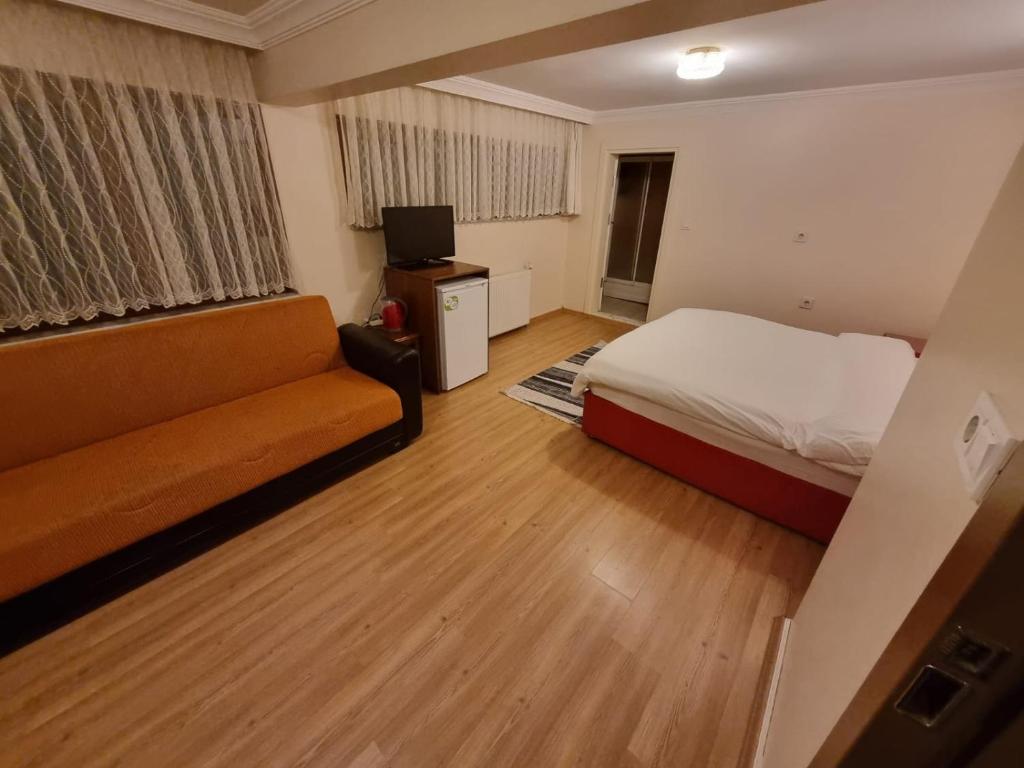 Кровать или кровати в номере SNOW HİLL HOUSE Pansiyon