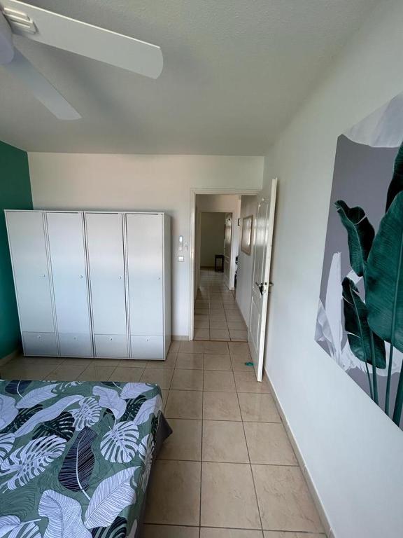 Postel nebo postele na pokoji v ubytování Les Tuileries