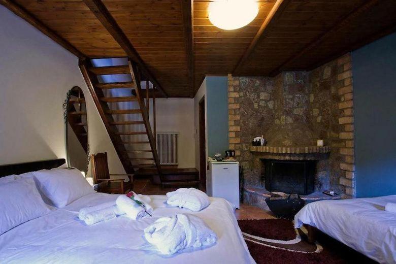 Postel nebo postele na pokoji v ubytování Fanaras Hotel