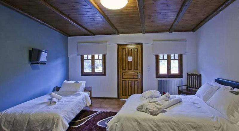 Postel nebo postele na pokoji v ubytování Fanaras Hotel