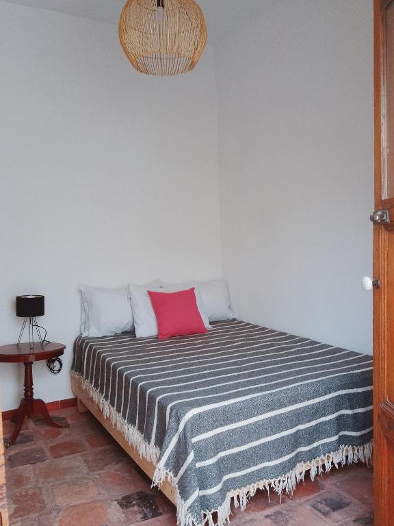 Postel nebo postele na pokoji v ubytování Casita de Piedra